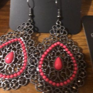 Brand New. Never been worn. Paparazzi multi color/design fish hook earrings.